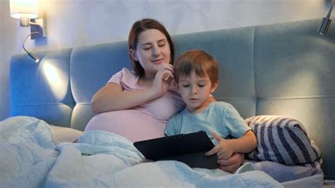 Mother And Son Sleeping In Bed stock videos and footage.